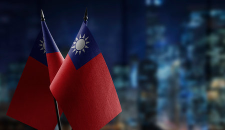 Small flags of the Taiwan on an abstract blurry background.の写真素材