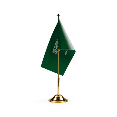 Small national flag of the Saudi Arabia on a white background.の写真素材