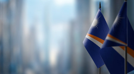 Small flags of the Marshall on an abstract blurry background.の写真素材