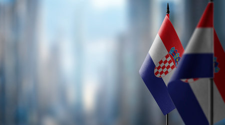 Small flags of the Croatia on an abstract blurry background.の写真素材