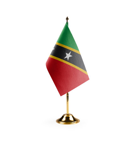 Small national flag of the Saint Kitts and Nevis on a white background.の写真素材