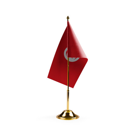 Small national flag of the Tunisia on a white background.の写真素材