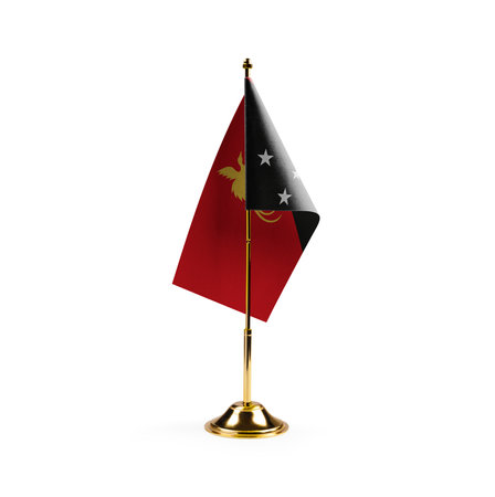 Small national flag of the Papua New Guinea on a white background.の写真素材
