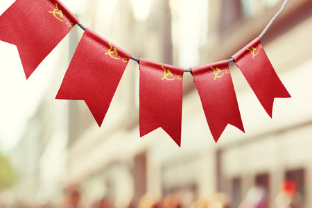 A garland of USSR national flags on an abstract blurred background.の写真素材
