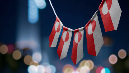 A garland of Greenland national flags on an abstract blurred background.の写真素材