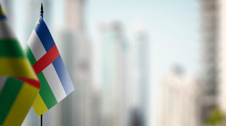 Small flags of the Central African Republic on an abstract blurry background.の写真素材