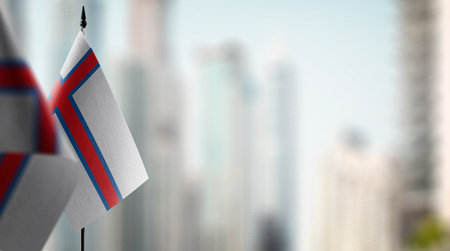 Small flags of the Faroe Islands on an abstract blurry background.の写真素材
