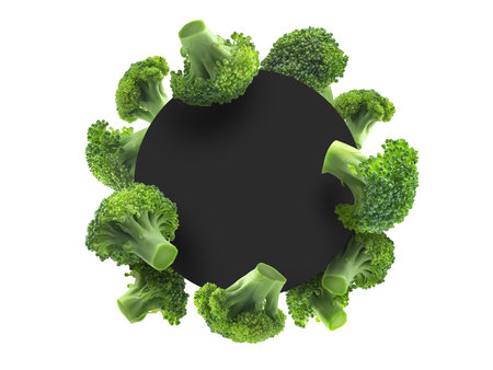 Green broccoli on a white background with a black circle in the centerの写真素材
