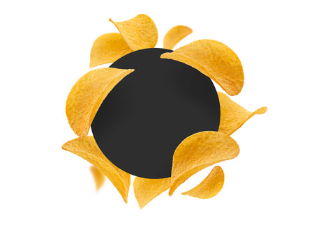 Potato chips on a white background with a black circle in the centerの写真素材
