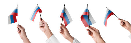 The Russia flag in hand in different angles on a white backgroundの写真素材