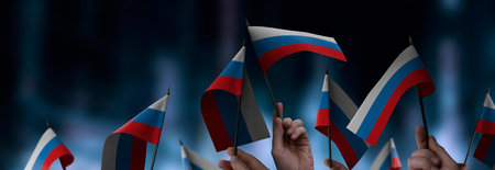 Russia flags in their hands on a blurred urban backgroundの写真素材