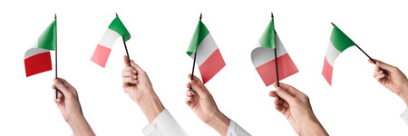 The Italy flag in hand in different angles on a white backgroundの写真素材