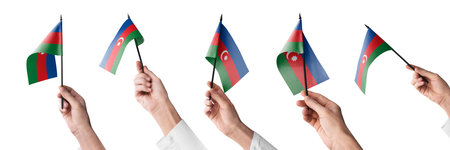 The Azerbaijan flag in hand in different angles on a white backgroundの写真素材