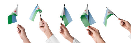 The Djibouti flag in hand in different angles on a white backgroundの写真素材