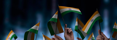 India flags in their hands on a blurred urban backgroundの写真素材
