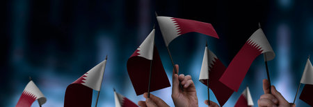 Qatar flags in their hands on a blurred urban background