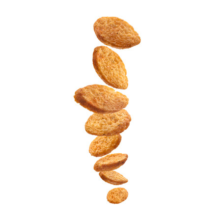 Bread croutons levitate on a white background