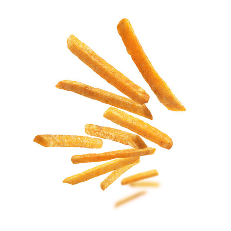 French fries levitate on a white background