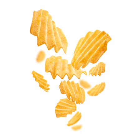 Fluted potato chips levitate on a white backgroundの写真素材
