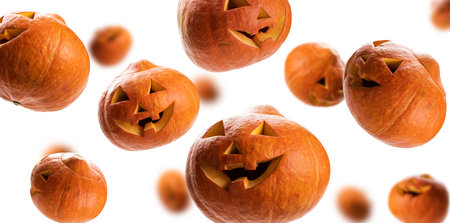 Floating Halloween Pumpkins featuring Grinning Faces, great for autumn festivities and decorationsの写真素材