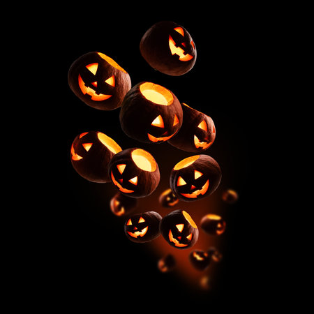 Glowing pumpkins levitate on a black backgroundの写真素材