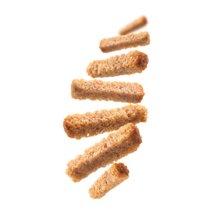 Bread croutons levitate on a white backgroundの写真素材