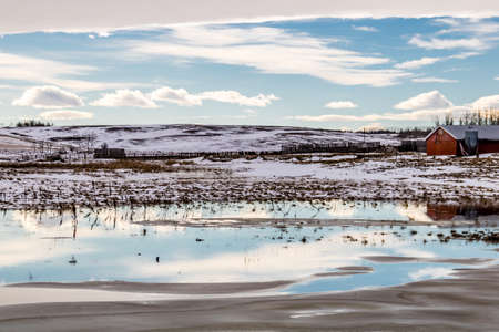 Chinook arch over a farmers field, Stettler County, Alberta, Canadaの写真素材