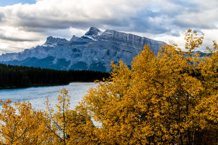 Two Jack Lake is a stunning view in the morning, still lake reflections and mountain views are...