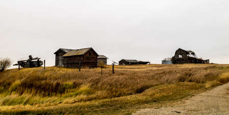 Abondoned farm out buildings on the prairies, Saskatchewan, Canadaの写真素材