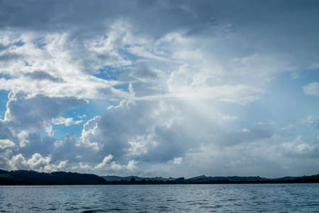 loney islands, bright blue skies, small and large islands, lonely islands, studded with trees, there...