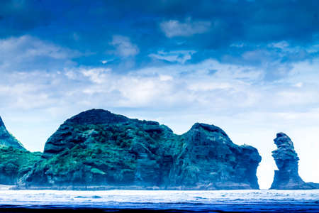black sand beachs, volcanic rock formations, lush green forests and rolling surf make this beach a...