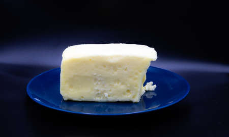Butter on a blue plate against colourful back drop. Calgary, Alberta, Canada