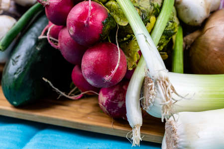 Colourful assorted raw vegetables on a wooden cutting board. Calgary, Alberta, Canada