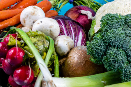 Colourful assorted raw vegetables on a wooden cutting board. Calgary, Alberta, Canadaの写真素材