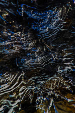 Running water under ice, Mosquito Creek.. Banff National Park.の写真素材