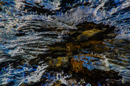 Running water under ice, Mosquito Creek.. Banff National Park.の写真素材