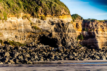 Hills and rock formations on Opunaki Beach. Opunaki, New Zealandの写真素材