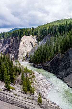The Ram River flows through the mountain side under the Ram falls. Ram Falls Provincial Park. Alberta, Canadaの写真素材