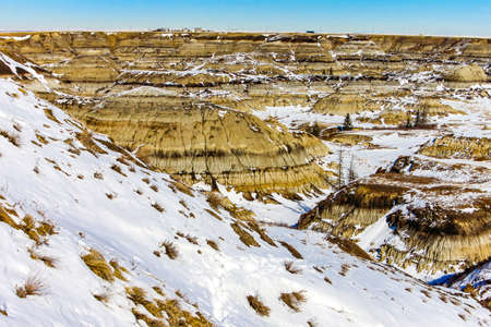 Snow starts to melt in Horseshoe Canyon, Drumheller, Alberta, Canadaの写真素材