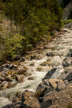 Roadside creek rumbles by the road Banff Windermer HWY Kootenay National Park British Columbia...