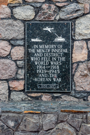 Cenotaph sits in town celebrating the fallen in all conflicts. Innisfail, Alberta, Canadaのeditorial素材