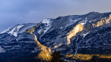 Sun rising on the Rockies Dead Mans Flats Alberta Canadaの写真素材