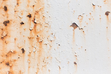 Metal painted white with rust stainsの写真素材