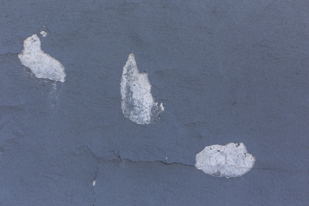 Chips off of gray textured wallの写真素材