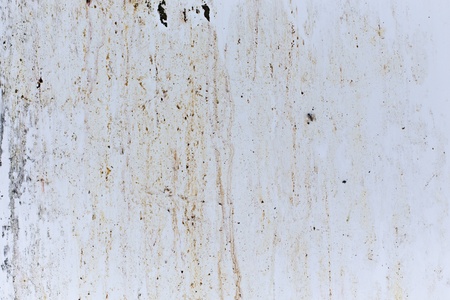 Grungy stain marks on white metal panelの写真素材