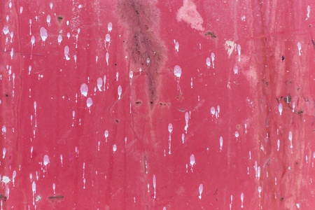 Texture of paint drips on red metalの写真素材