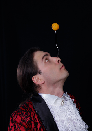 The juggler have a balanse ball on the spoonの写真素材