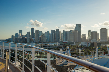 Miami Skyline and shipping docks from cruise ship with cruise ship board foregroundの写真素材