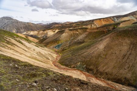 Landmannalaugar Valley. Iceland. Colorful mountains on the Laugavegur hiking trail. The combination of layers of multi-colored rocks, minerals, grass and mossの写真素材