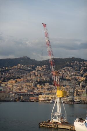 Huge cargo crane with Panoramic view port of Genoa in a summer day, Italy.の写真素材